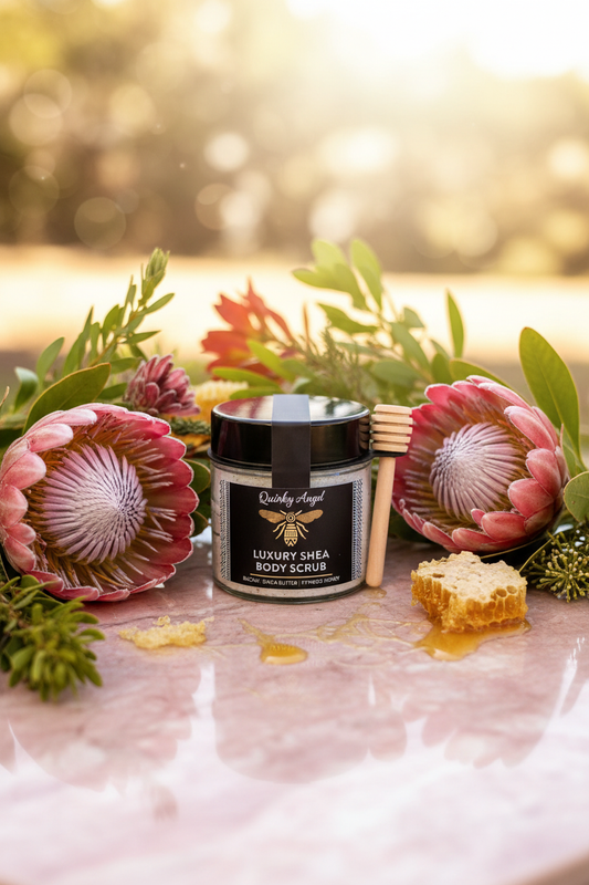 Honeysuckle Luxury Shea Body Scrub hero shot with protea flowers