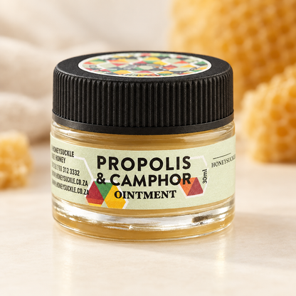 Honeysuckle Propolis and Camphor Ointment 30ml jar with label on an ivory surface