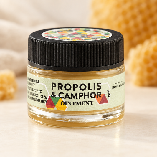 Honeysuckle Propolis and Camphor Ointment 30ml jar with label on an ivory surface