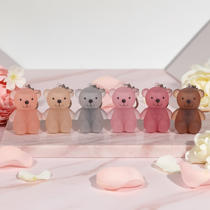 All 6 Little Bear Velvet Lip Glaze shades in a row on pink marble
