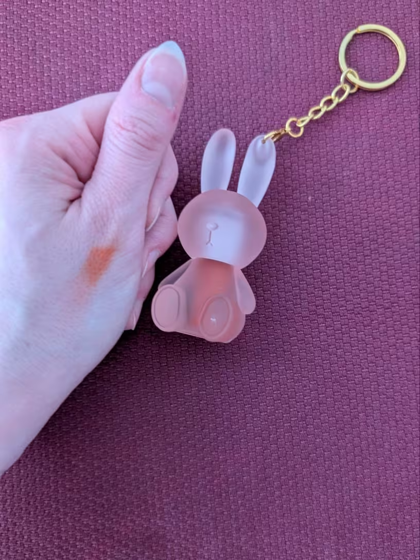 Bunny lip gloss keychain detail shot with gold ring