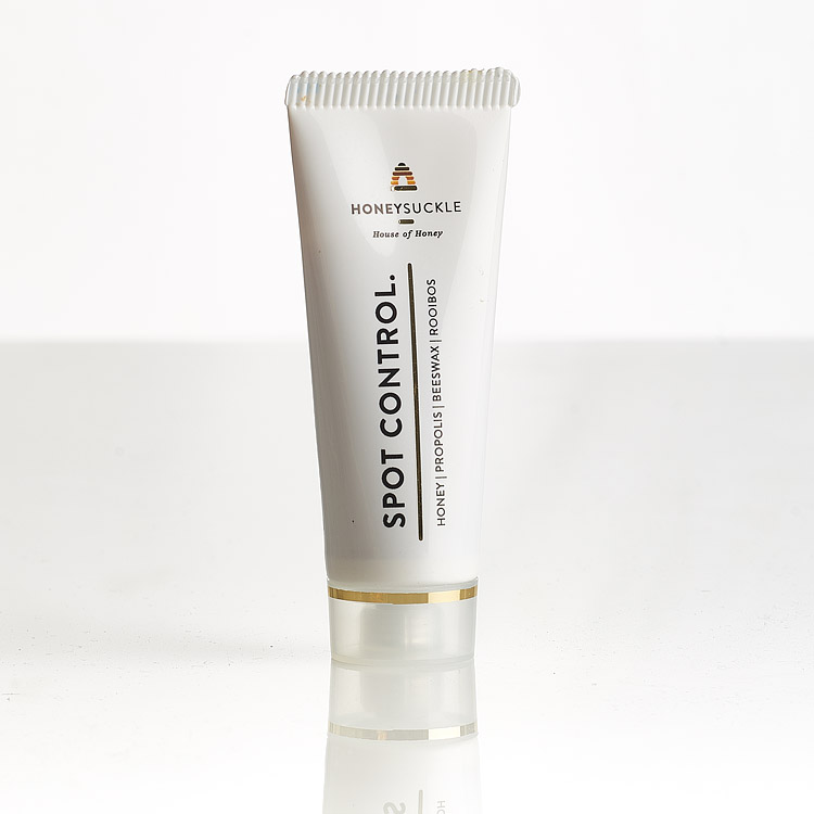 Original clean product-only photo of Honeysuckle Spot Control 25ml tube with gold band and clear cap