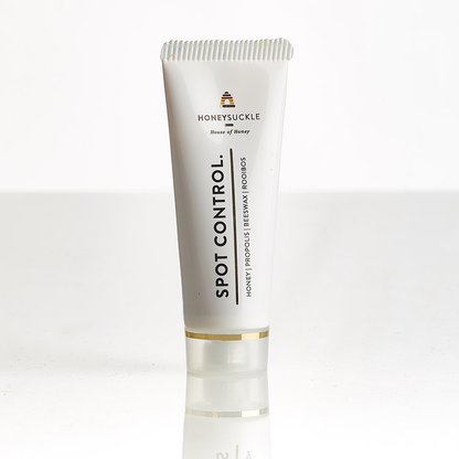 Original clean product-only photo of Honeysuckle Spot Control 25ml tube with gold band and clear cap