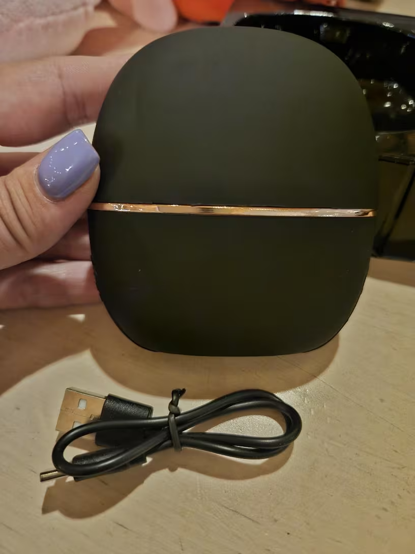 Mini hair straightener comb in use