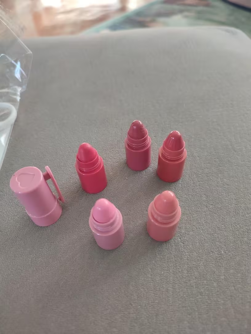 Hand holding assembled 5-in-1 gradient lipstick pen