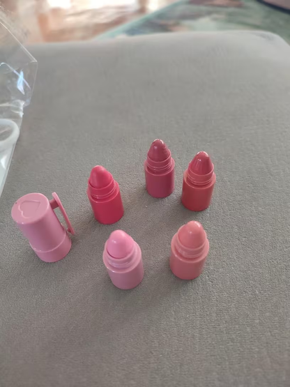Hand holding assembled 5-in-1 gradient lipstick pen