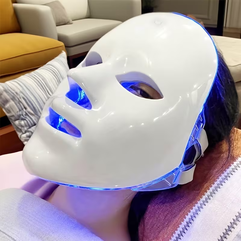 Lightweight 188g LED face mask held by model - no burden on face